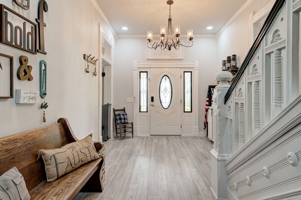 The entry hall — original staircase and front door