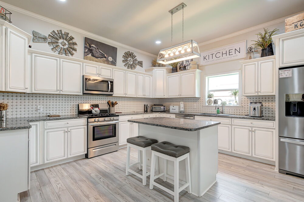 The updated kitchen — modern cabinetry and granite countertops